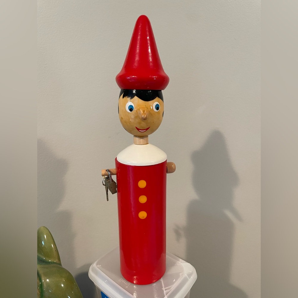 Pinnochio Handpainted wood bank with lock and key. 12” high. Vintage.